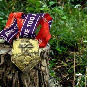 Charitable running medal for orphan support with city and child silhouette