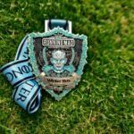 Game of Thrones Themed Winter Run Challenge Medal on Lush Greenery