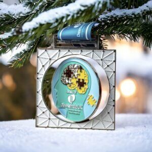 Run for Dementia UK Virtual Challenge medal with puzzle design in snow