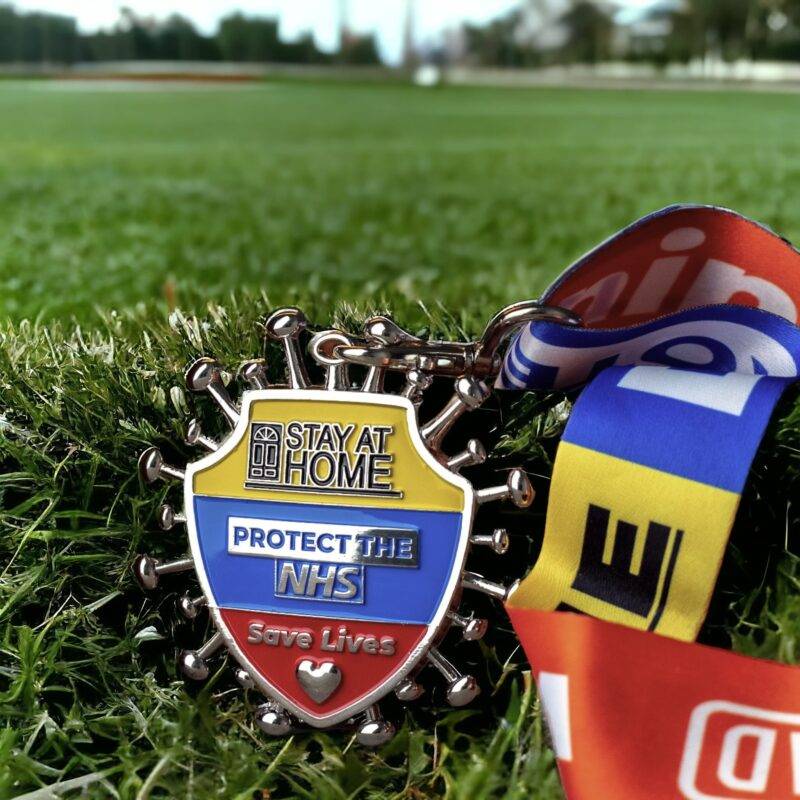 NHS support medal on grass background