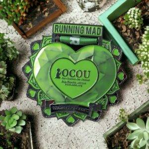 Commemorative green heart medal from Running Mad for the OCOU