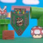 Bowser medal from the Super Smash Series by Running Mad against a video game backdrop.