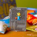 The Simpsons Series fun challenge medal showcasing baby Maggie with a pacifier