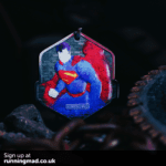 Superman emblem on running medal with a heroic blue and red color scheme.