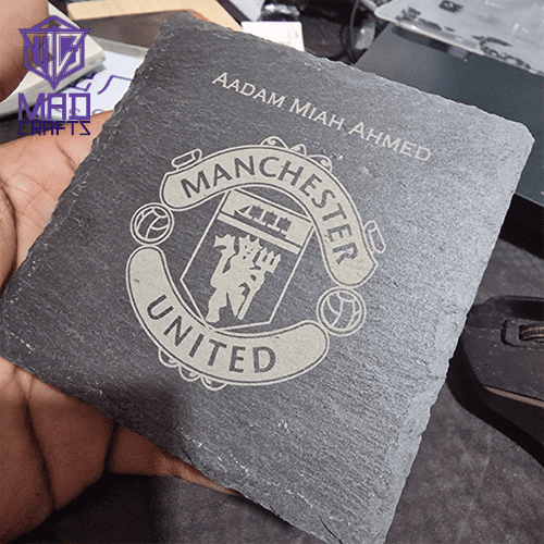 Custom-engraved slate coaster with Manchester United logo and personalized name