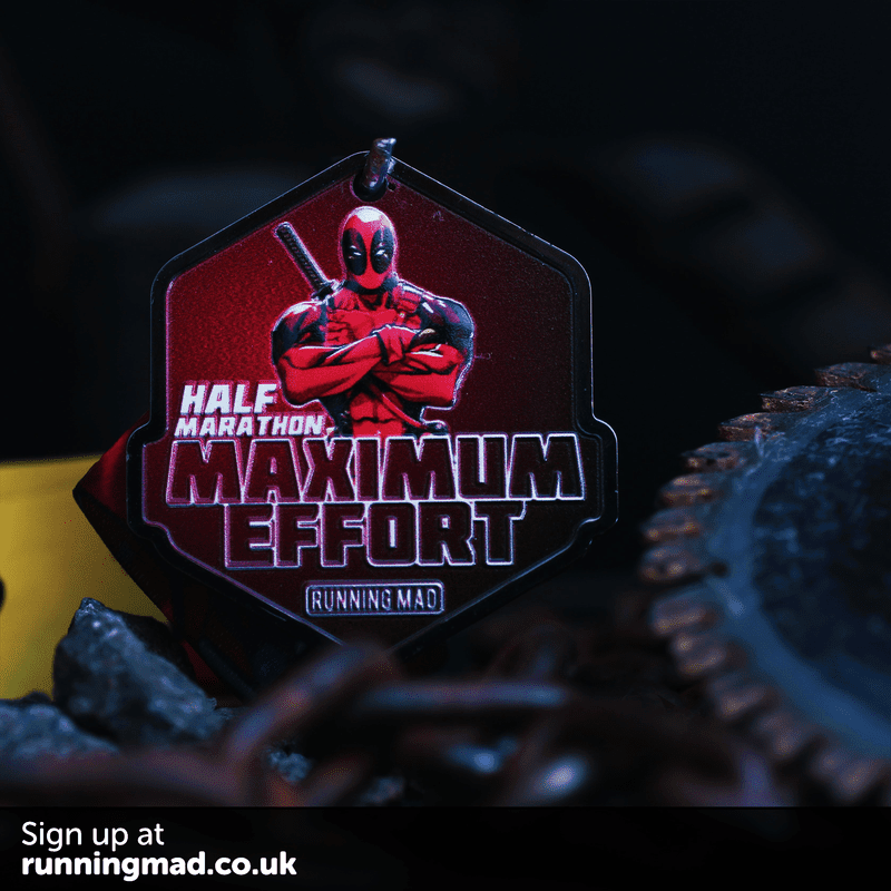 Deadpool comedic action pose running medal with vibrant colors.