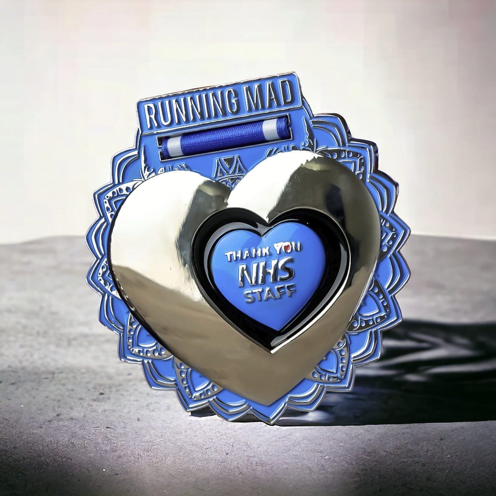 Shiny NHS Thank You Challenge Medal for NHS Staff by Running Mad on Concrete