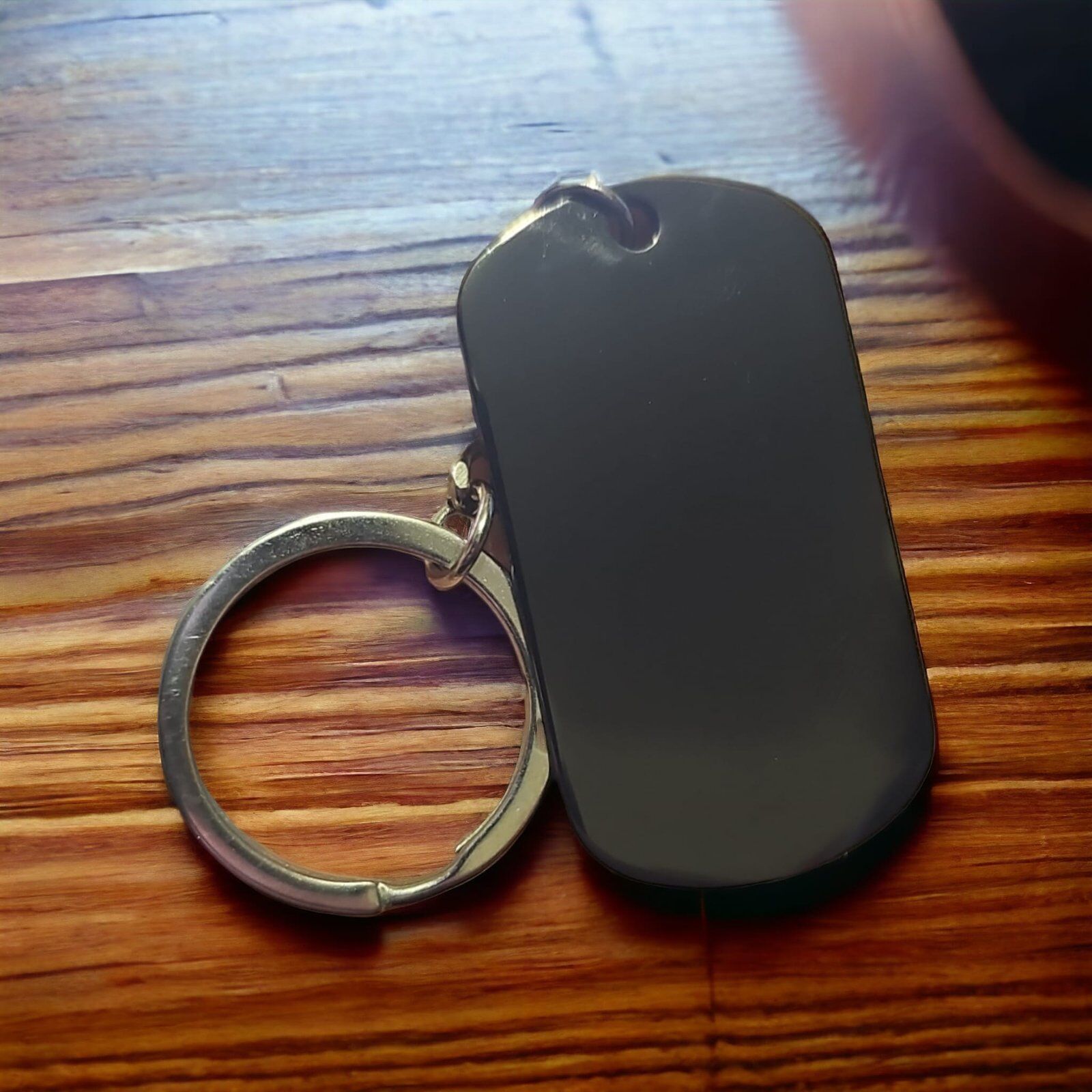 Black Custom Dog Tag Keyring on Wooden Surface
